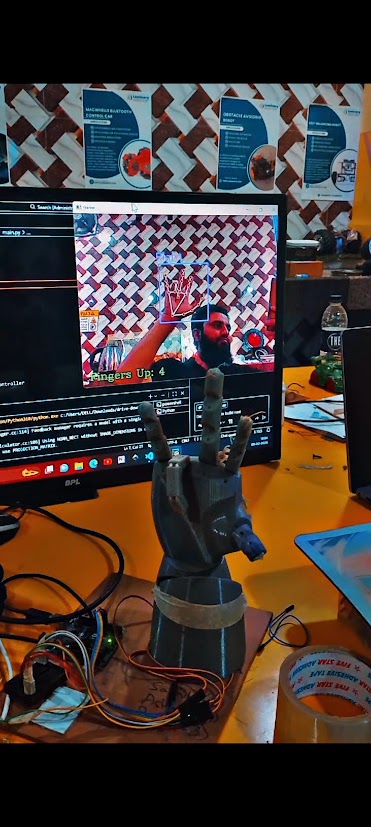 3D-printed robotic hand controlled by a webcam hand-tracking Python script